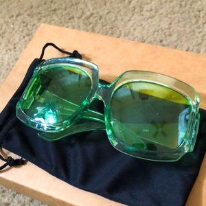 Oversized plastic green lens & frame sunglasses.
